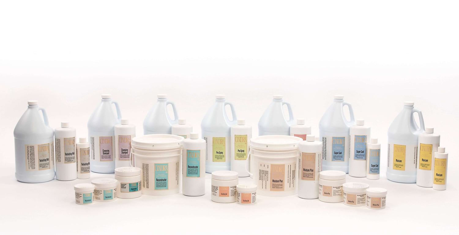 Collection of Cindra Professional Dog Grooming Products including shampoos, conditioners, and styling gels.