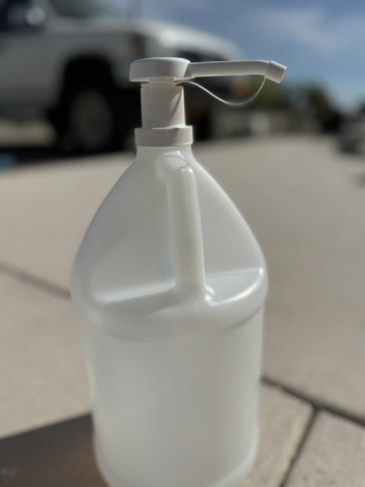 a gallon pump displayed on a empty gallon bottle 