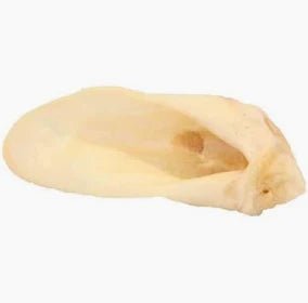 Single air-dried lamb ear chew for dogs on white background, natural high-protein dog treat by Cindra Pet Products