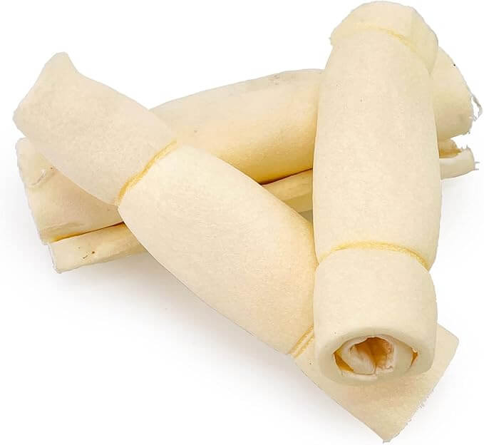 Natural 5 to 6 inch beef cheek rolls for dogs on white background, long-lasting rawhide alternative chew by Cindra Pet Products