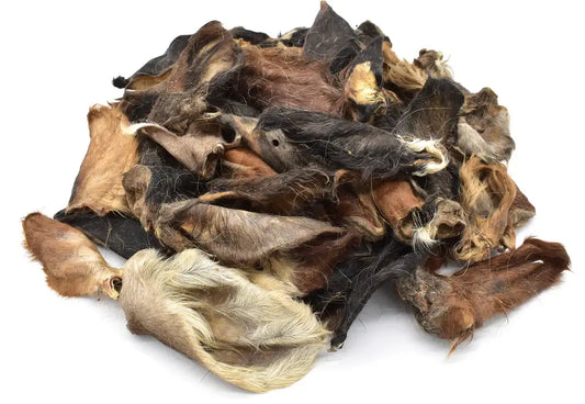 Heap of dried cow ears on a white background