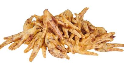 Dried chicken feet treats stacked together, all-natural crunchy chews for dogs.