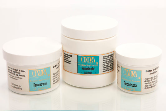 Dog Coat Repair Treatment | Cindra Reconstructor jars for coat restoration, hydration, and shine.